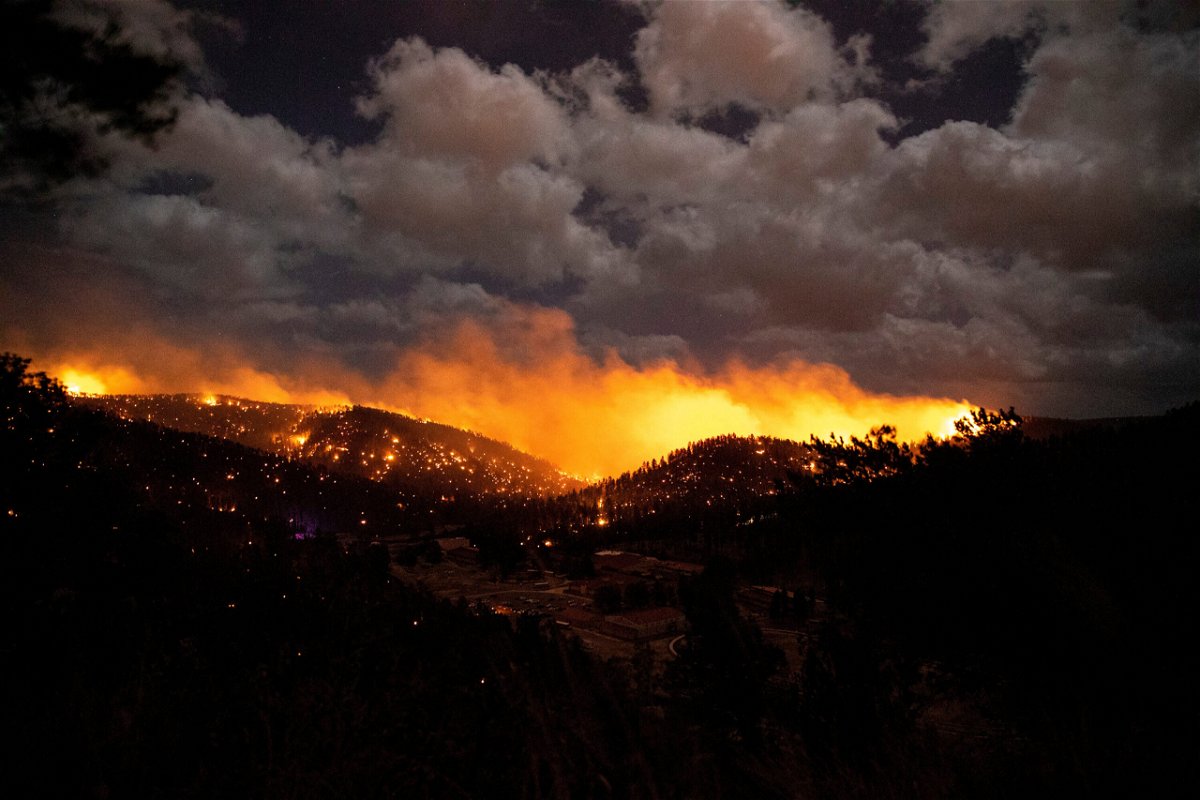 <i>Ivan Pierre Aguirre/USA Today/Reuters</i><br/>The McBride Fire burns Tuesday in the heart of the village of Ruidoso