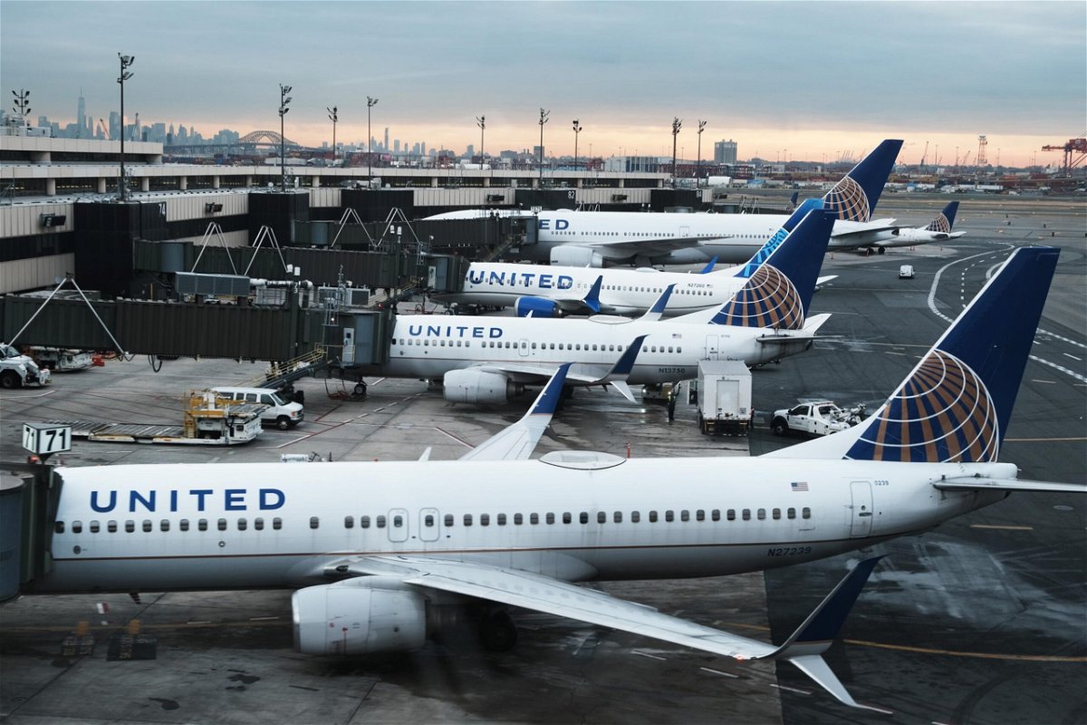 <i>Spencer Platt/Getty Images</i><br/>A few US airlines announced Monday that masks are now optional on their aircraft. United Airlines planes sit on the runway at Newark Liberty International Airport on November 30