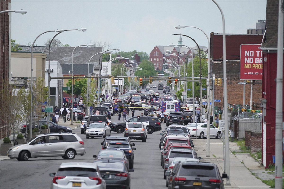 <i>Derek Gee/The Buffalo News/AP</i><br/>Police vehicles block off the street where at least 10 people were killed in a mass shooting at a Buffalo supermarket.