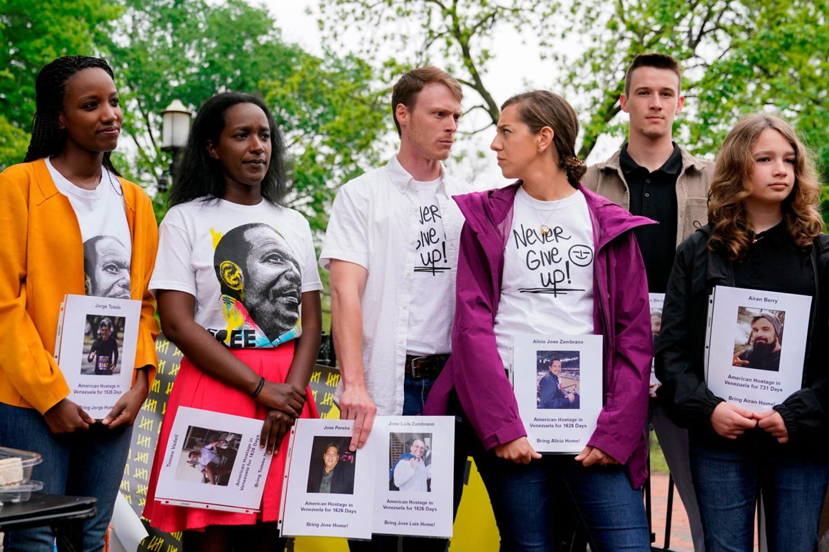 <i>Patrick Semansky/AP</i><br/>Family members of Americans who are being held hostage or wrongfully detained overseas attend a news conference in Lafayette Park near the White House