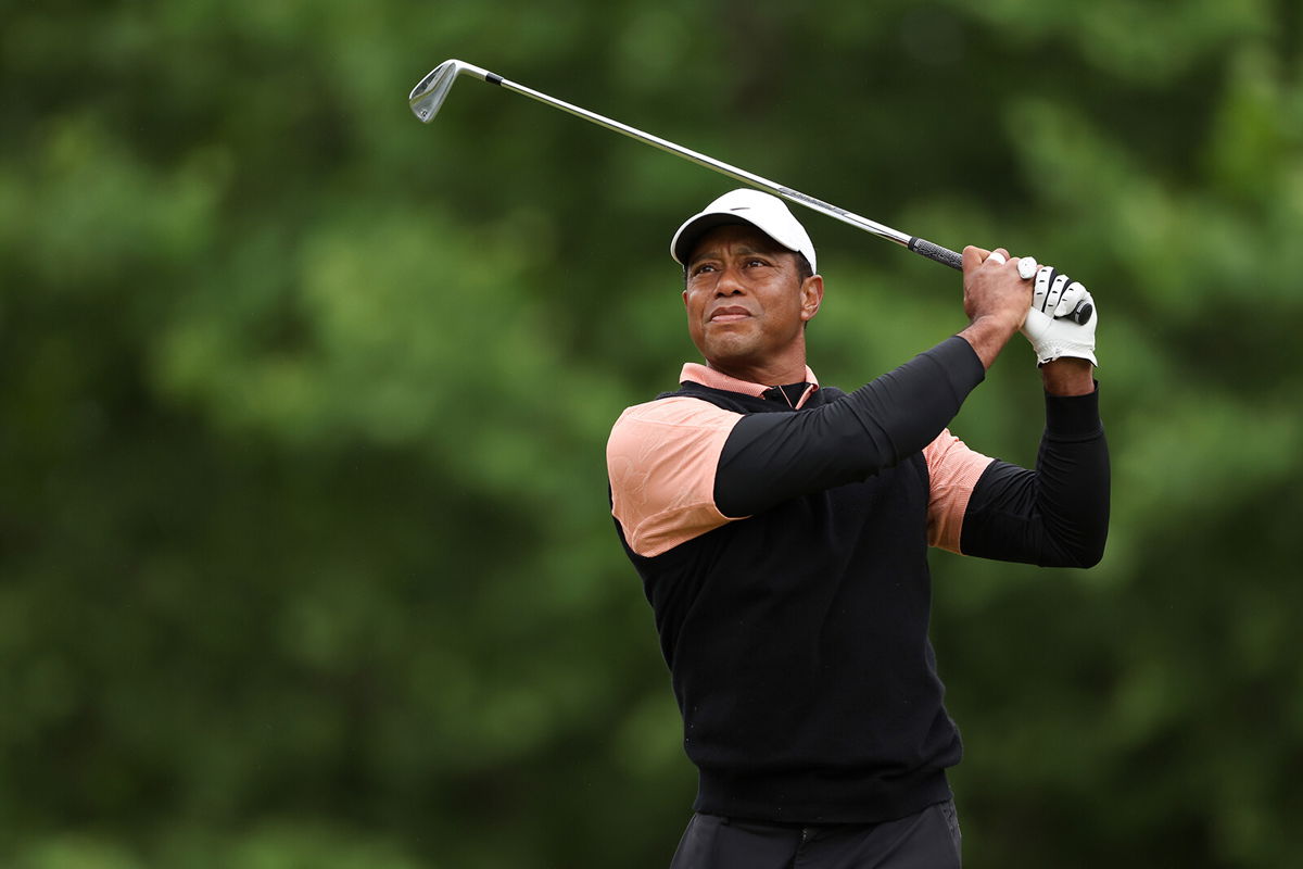 <i>Christian Petersen/Getty Images</i><br/>Woods plays his shot from the 14th tee during the third round of the 2022 PGA Championship.