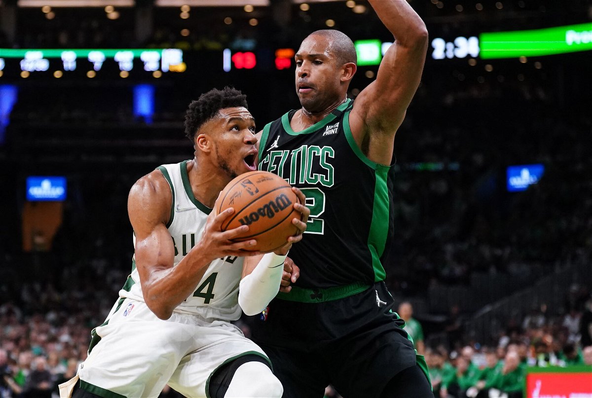 <i>David Butler II//USA TODAY Sports/Reuters</i><br/>'The Greek Freak' drives the ball against Celtics center Al Horford.