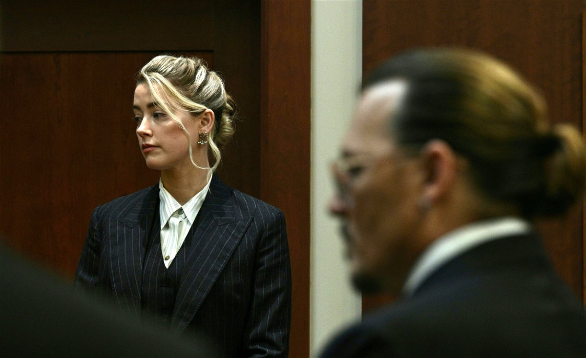 <i>Brendan Smialowski/Pool/AFP/Getty Images</i><br/>Amber Heard and Johnny Depp watch as the jury comes into the courtroom on on May 17.