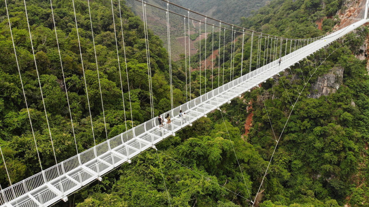 <i>NHAC NGUYEN/AFP via Getty Images</i><br/>This aerial photo shows the newly constructed Bach Long glass bridge in Moc Chau district in Vietnam's Son La province on April 29.