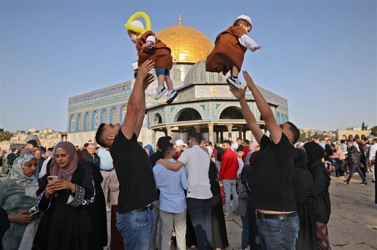 <i>Ahmad Gharabli/AFP/Getty Images</i><br/>Muslims play with their children in front of the Dome of the Rock after the Eid al-Fitr prayer in Jerusalem's Old City on May 2.