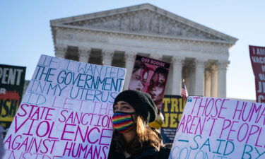 Abortion rights advocates and anti-abortion protesters demonstrate in front of the Supreme Court on Dec. 1