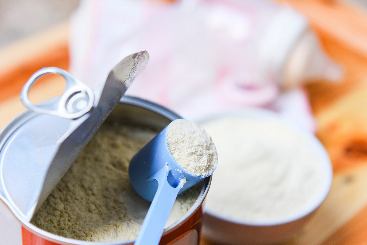 <i>Adobe Stock</i><br/>Seen here is milk powder in a spoon.