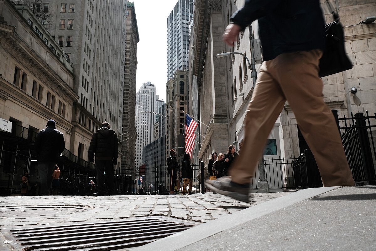 <i>Spencer Platt/Getty Images</i><br/>People walk by the New York Stock Exchange on April 4