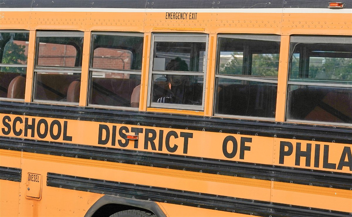 <i>Joseph Kaczmarek/Shutterstock</i><br/>A student wearing a face mask rides a school bus on May 23 in Philadelphia. Philadelphia-area schools reinstated face masks in schools