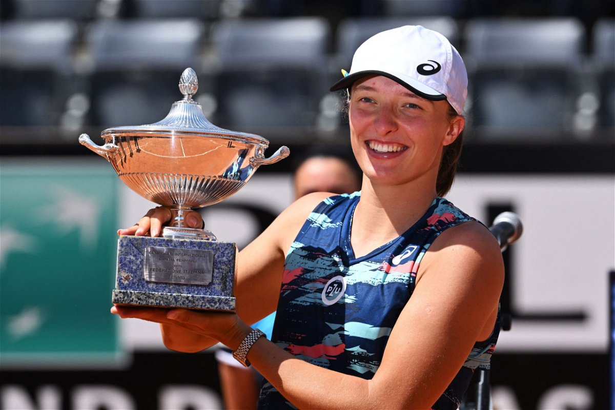 <i>TIZIANA FABI/AFP/Getty Images</i><br/>Iga Swiatek poses with the winner's trophy after defeating Tunisia's Ons Jabeur to win the final of the Women's WTA Rome Open tennis tournament on May 15.