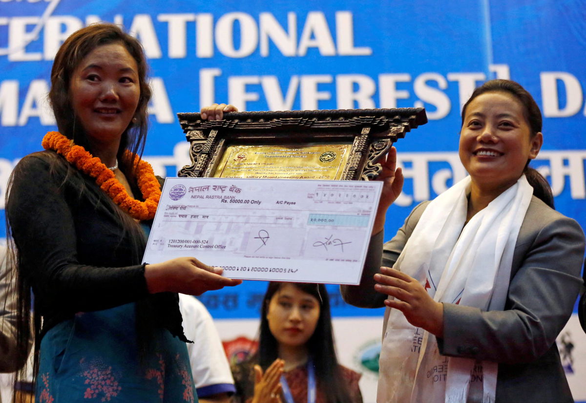 <i>Navesh Chitrakar/Reuters</i><br/>48-year-old Nepali woman Lhakpa Sherpa (left) scaled Mount Everest for the 10th time on May 12