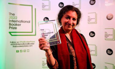 Author Geetanjali Shree poses with the 2022 International Booker Prize award for her novel 'Tomb of Sand' in London on May 26.