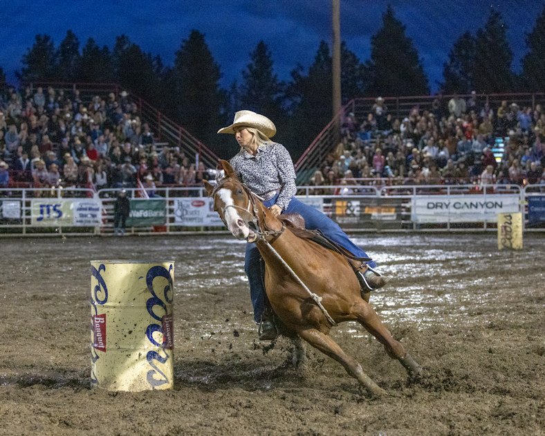 Sisters Rodeo muddy barrel racing Saturday night Outlaws Photography 611