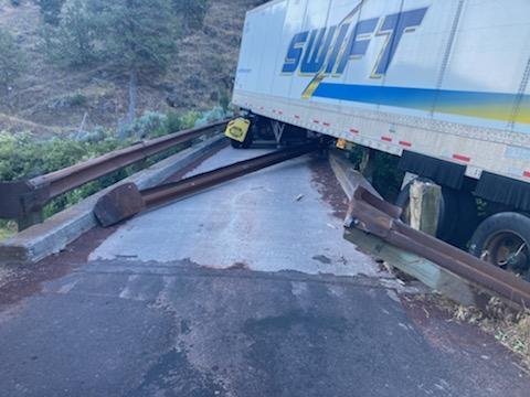 A Swift truck driver had a bad night at the Willow Creek Bridge on Pelton Dam Road