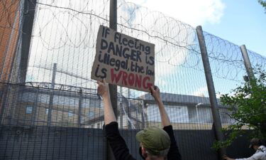 Demonstrators protest outside of Brook House Immigration Removal Centre against a planned deportation of asylum seekers from Britain to Rwanda