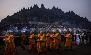 Buddhist monks walk around the Borobudur temple during celebrations for Vesak Day.