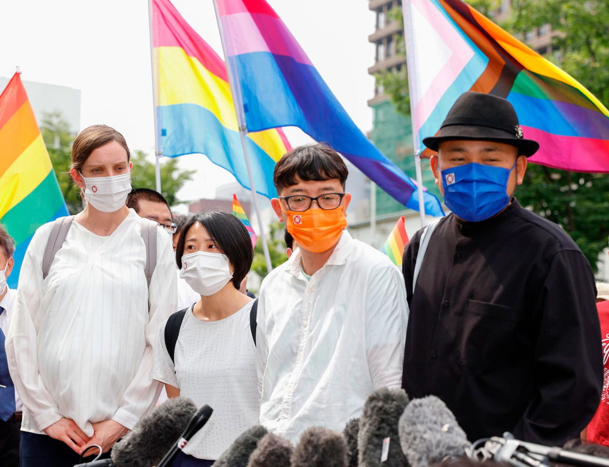 <i>AP</i><br/>Plaintiffs outside the Osaka district court in Japan on June 20. The court ruled the country's ban on same-sex marriage does not violate the constitution.