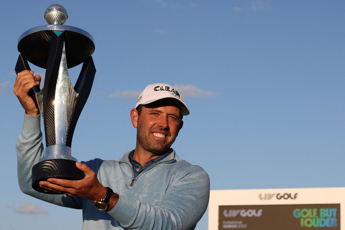 <i>ADRIAN DENNIS/AFP/AFP via Getty Images</i><br/>South African golfer Charl Schwartzel celebrates his victory at the LIV Golf Invitational.