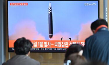 People in Seoul watch a news broadcast showing footage of a North Korean missile test.