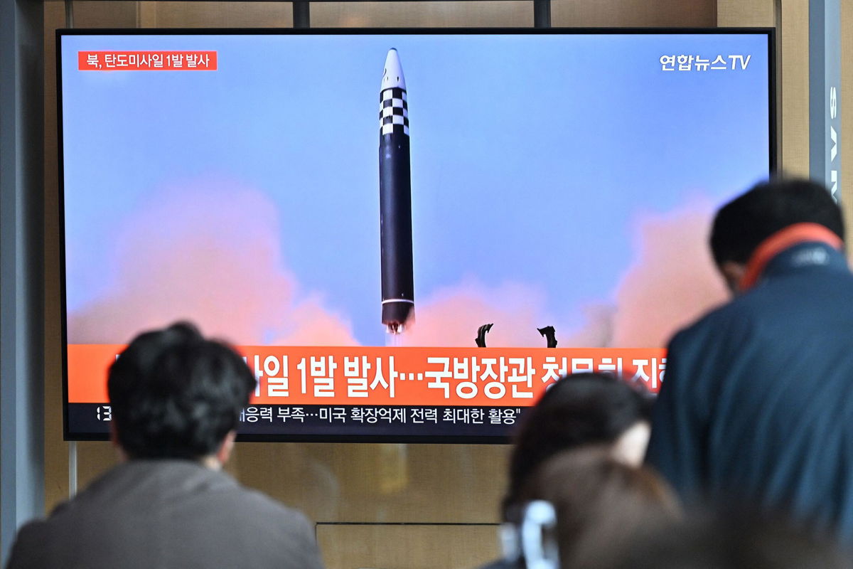 <i>Jung Yeon-Je/AFP/Getty Images</i><br/>People in Seoul watch a news broadcast showing footage of a North Korean missile test.