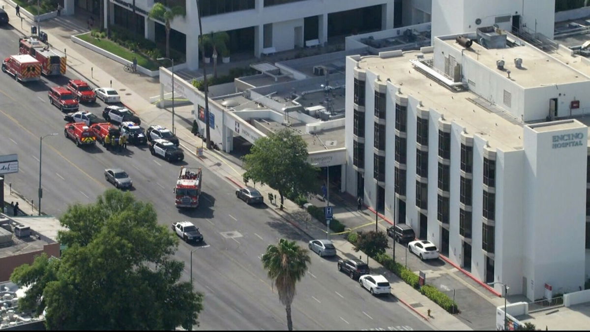 <i>KCAL/KCBS</i><br/>Emergency workers respond to the scene of a reported stabbing at the Encino Hospital Medical Center in Los Angeles.