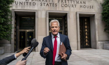 Former Trump White House Advisor Peter Navarro speaks to the media outside U.S. District Court on Friday