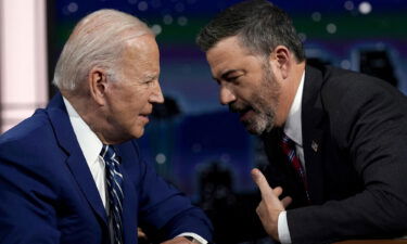 President Joe Biden speaks with host Jimmy Kimmel during a commercial break during the taping of Jimmy Kimmel Live!