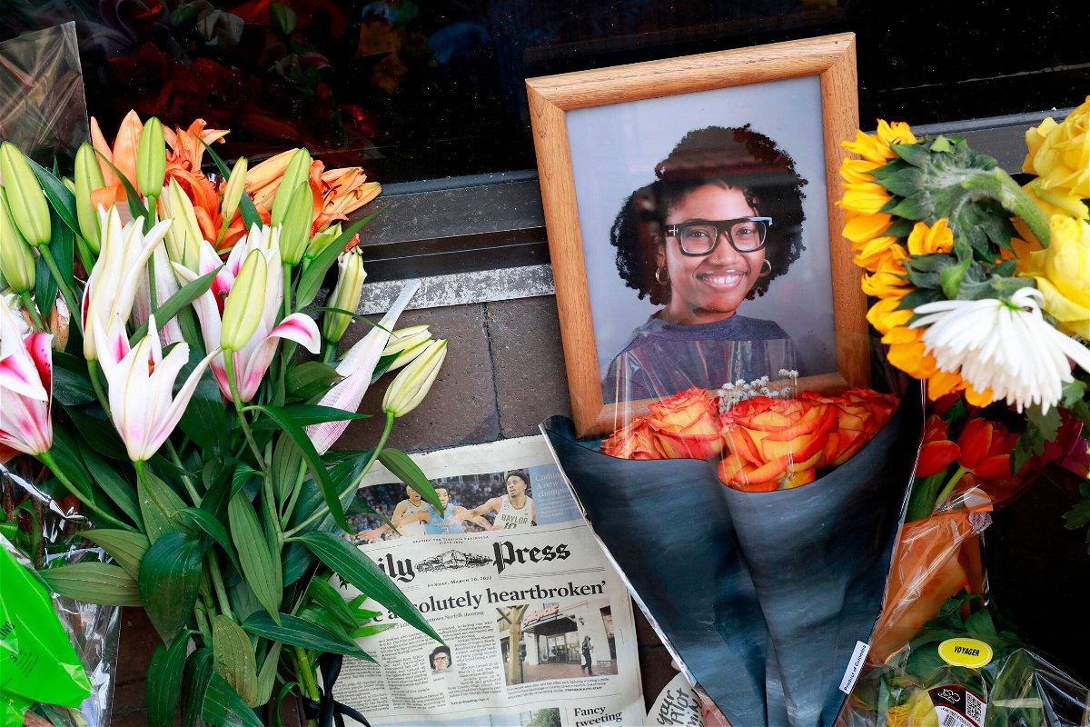 <i>Kaitlin McKeown/AP</i><br/>A memorial honors Sierra Jenkins and others shot outside a pizza restaurant in Norfolk