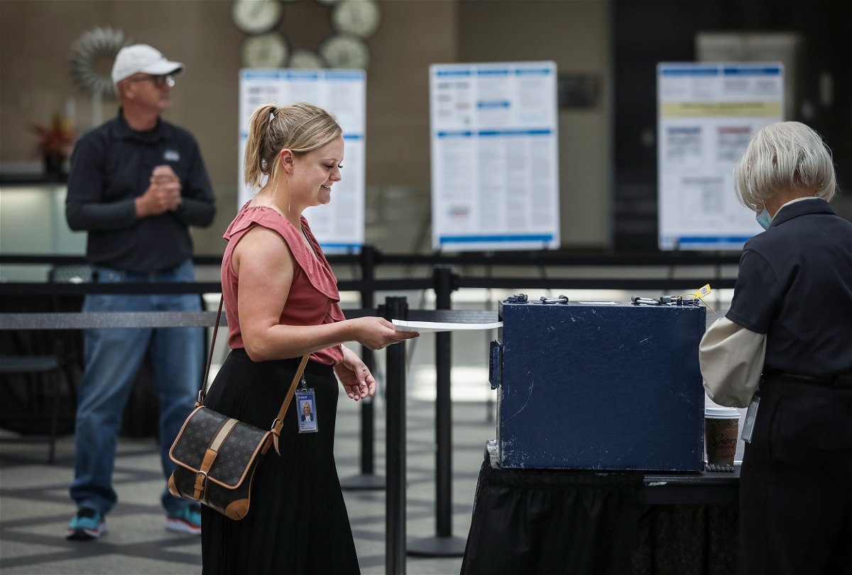 <i>Marc Piscotty/Getty Images</i><br/>Harper Brown of Denver turns in her ballot as she votes on June 28. Republicans in Colorado rejected a 2020 election denier to be their next secretary of state.