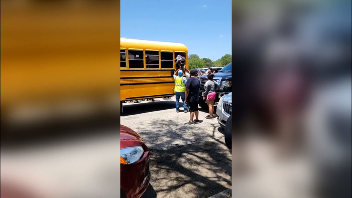 <i>Obtained by CNN</i><br/>Gilbert Mata exits a school bus through a window shortly after a gunman killed 19 of his classmates and two teachers.