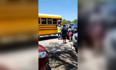 Gilbert Mata exits a school bus through a window shortly after a gunman killed 19 of his classmates and two teachers.