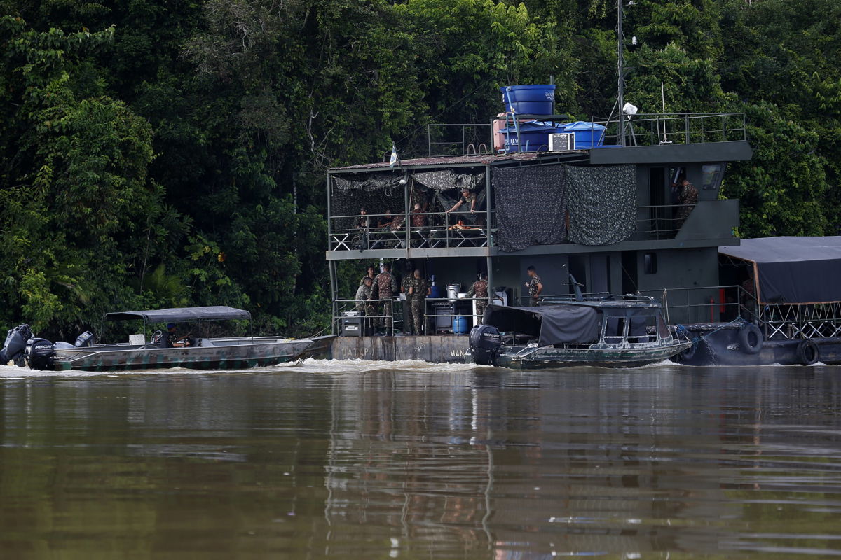 <i>Edmar Barros/AP</i><br/>Army soldiers search for British journalist Dom Phillips and Indigenous affairs expert Bruno Araujo Pereira aboard a river boat and speed boats on the Itaquai river