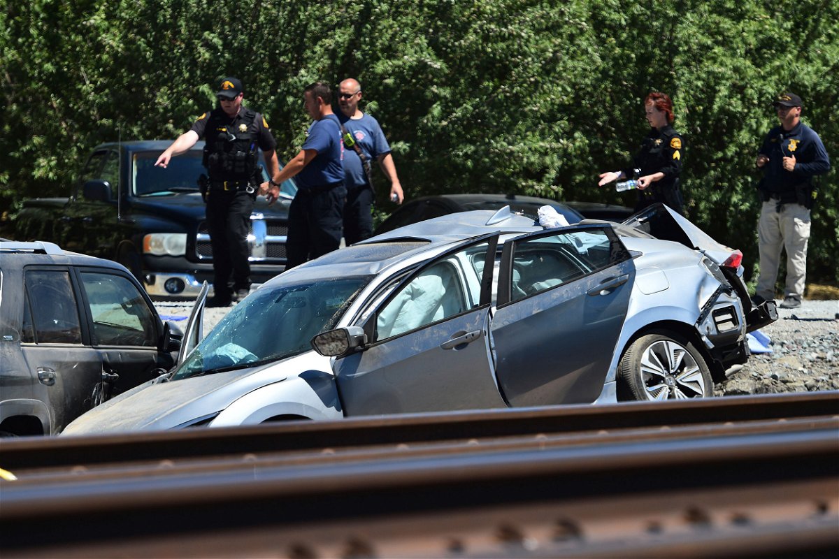 <i>Jose Carlos Fajardo/AP</i><br/>Contra Costa Sheriff deputies investigate the scene after an Amtrak train collided with a vehicle in Brentwood