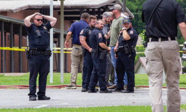 Officials gather outside Walnut Park Elementary School in Gadsden