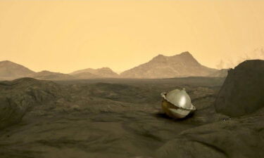This illustration shows the probe after it has reached the surface of Venus and venusian highlands can be seen in the background.
