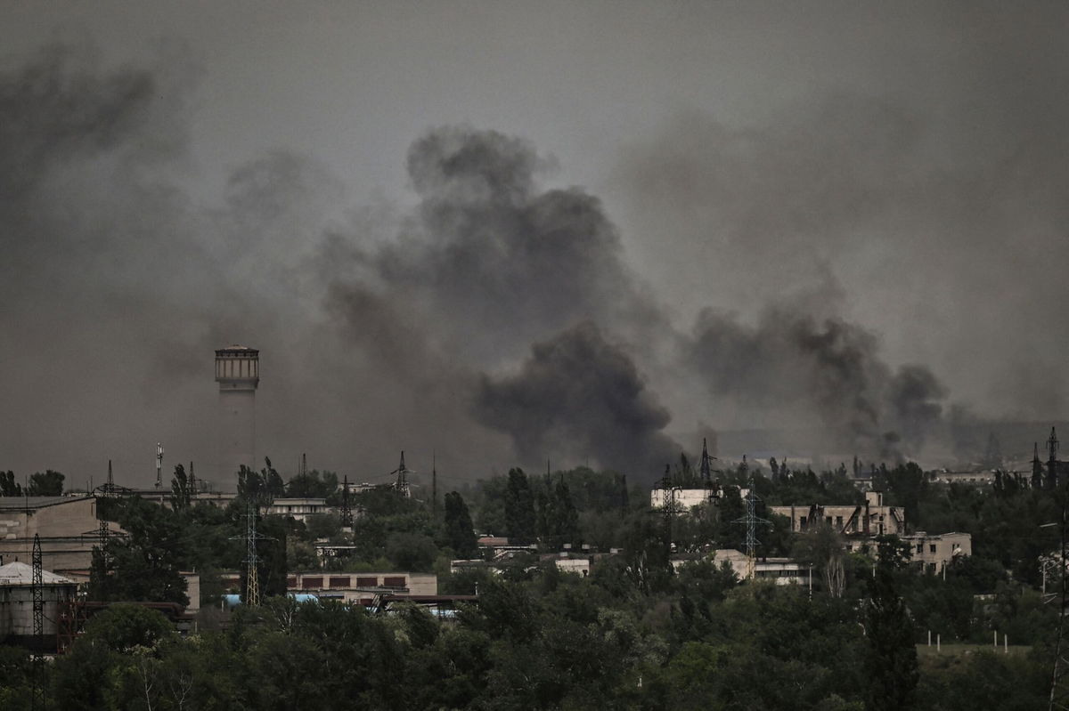 <i>ARIS MESSINIS/AFP via Getty Images</i><br/>Smoke and dirt rise in the city of Severodonetsk during fighting between Ukrainian and Russian troops at the eastern Ukrainian region of Donbas on June 2.