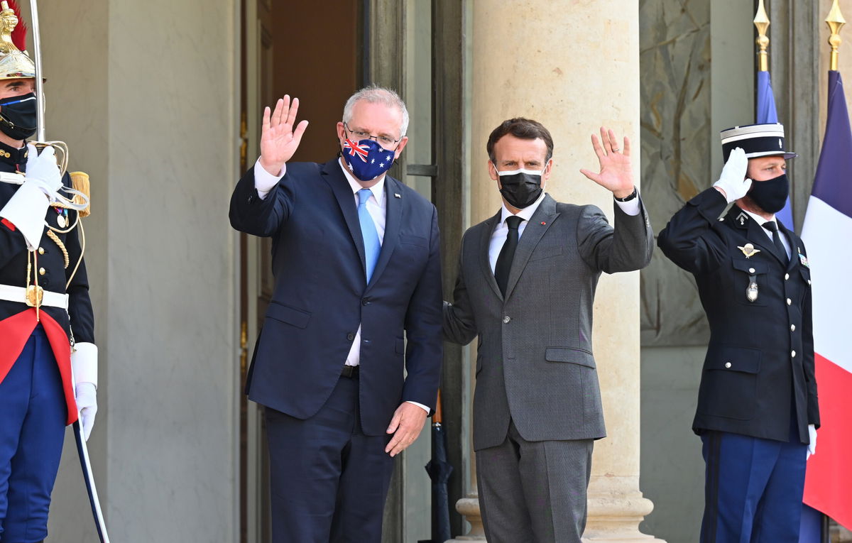 <i>Mustafa Yalcin/Anadolu Agency/Getty Images</i><br/>French President Emmanuel Macron (R) and Australian Prime Minister Scott Morrison (L) pose before dinner at the Elysee Palace in Paris