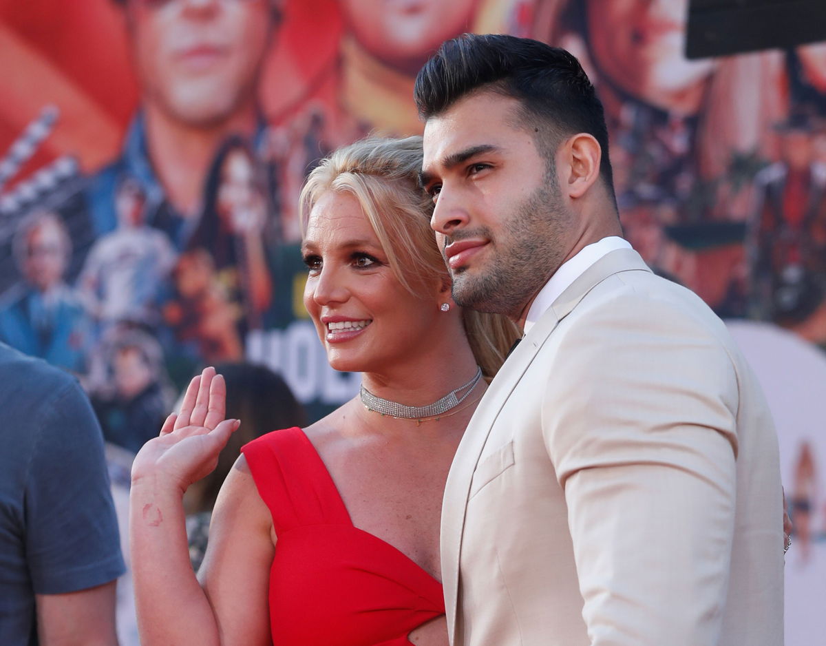 <i>Mario Anzuoni/Reuters</i><br/>Britney Spears and Sam Asghari pose at the premiere of 