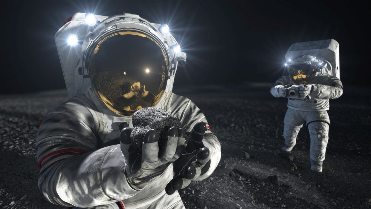 <i>NASA</i><br/>This artist's illustration shows two suited crew members working on the lunar surface.  New spacesuits made by Axiom Space and Collins Aerospace could be worn by astronauts that land on the moon later this decade through NASA's Artemis program