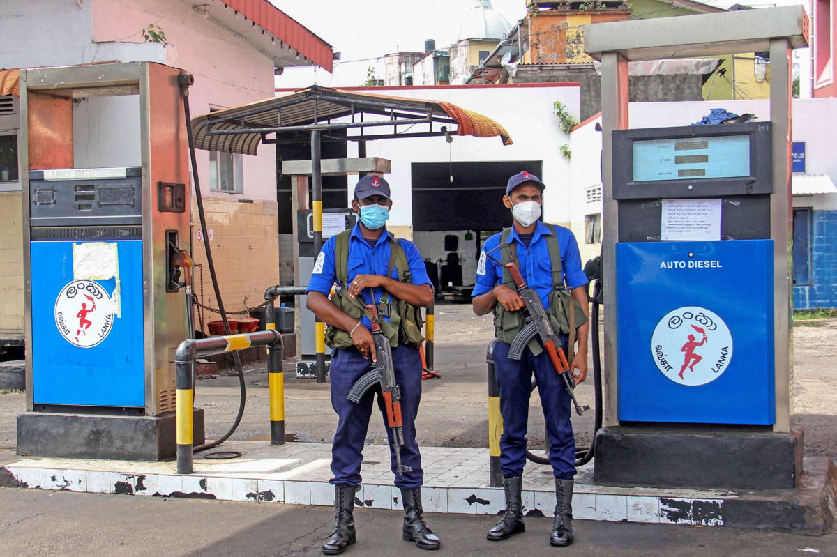 <i>AFP/Getty Images</i><br/>Naval officers guard a closed fuel station in Colombo
