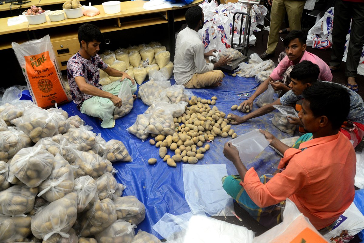 <i>Mamunur Rashid/NurPhoto/Getty Images</i><br/>Volunteers pack relief materials for flood affected people in Dhaka