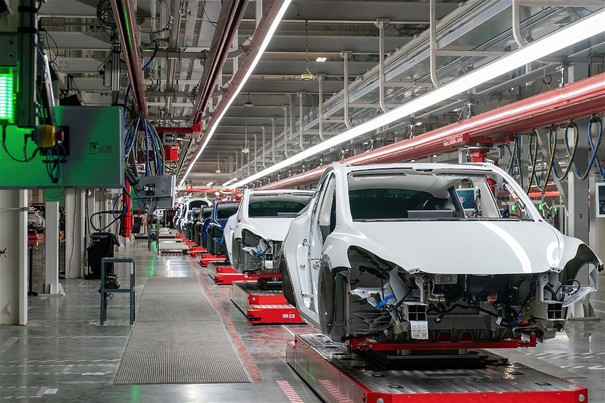 <i>Suzanne Cordeiro/AFP/Getty Images</i><br/>Cars are seen on the assembly line during a tour of the Tesla Giga Texas manufacturing facility ahead of the 
