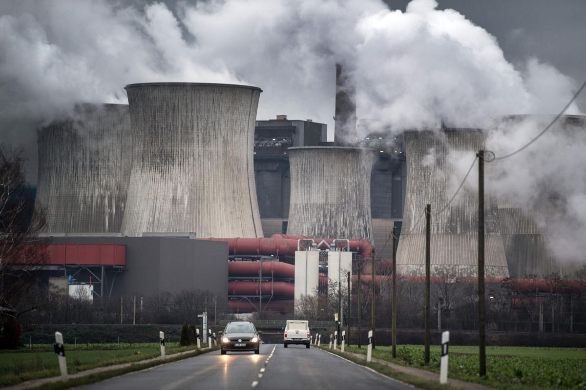 <i>Federico Gambarini/DPA/AFP/Getty Images</i><br/>Smoke and vapor rising from the cooling towers and chimneys of a lignite-fired power plant near Bergheim