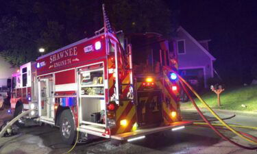 The City of Shawnee reported four firefighters were recovering in a hospital following a house fire Tuesday night.