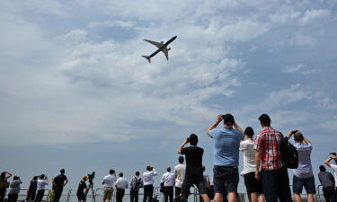 The aircraft soars through the sky during a demonstration flight at the Farnborough Airshow.