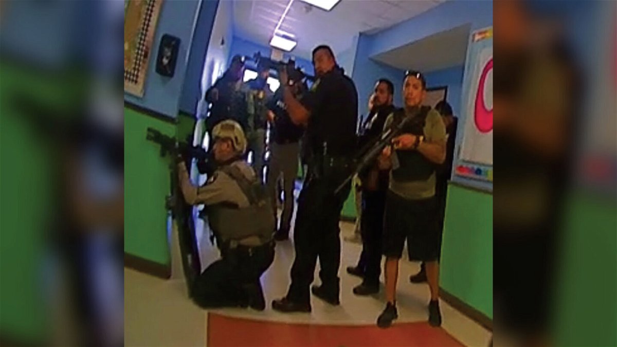 <i>Texas House Investigative Committee</i><br/>This photo released by the Texas House of Representatives Investigative Committee on the Robb Elementary School shooting shows responders positioned in the north end of a hallway at the school.