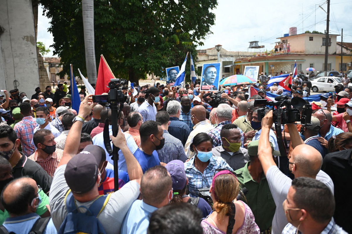<i>Yamil Lage/AFP/Getty Images</i><br/>Cuban President Miguel Diaz-Canel (C) is seen during a demonstration held by citizens to demand improvements in the country