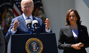 Vice President Kamala Harris listens as President Joe Biden delivers in the Rose Garden of the White House in Washington on May 9