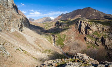 A group of tourists trekking in Kyrgyzstan's Tian Shan mountains on Friday survived a huge avalanche that swept right over them. Pictured are the Tien Shan mountains in Kyrgyzstan.