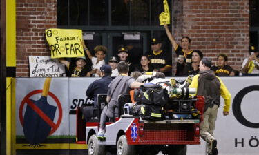 Jurickson Profar is cheered by fans as he is taken off by medics.